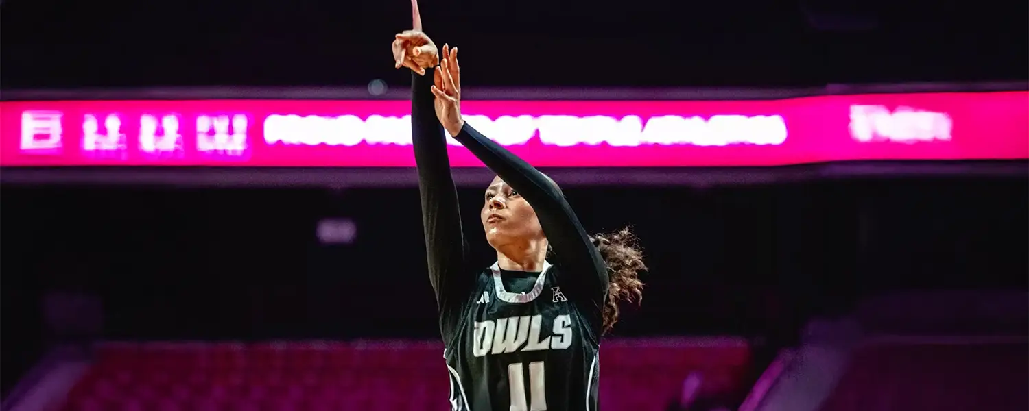 Dominique Ennis shooting basketball