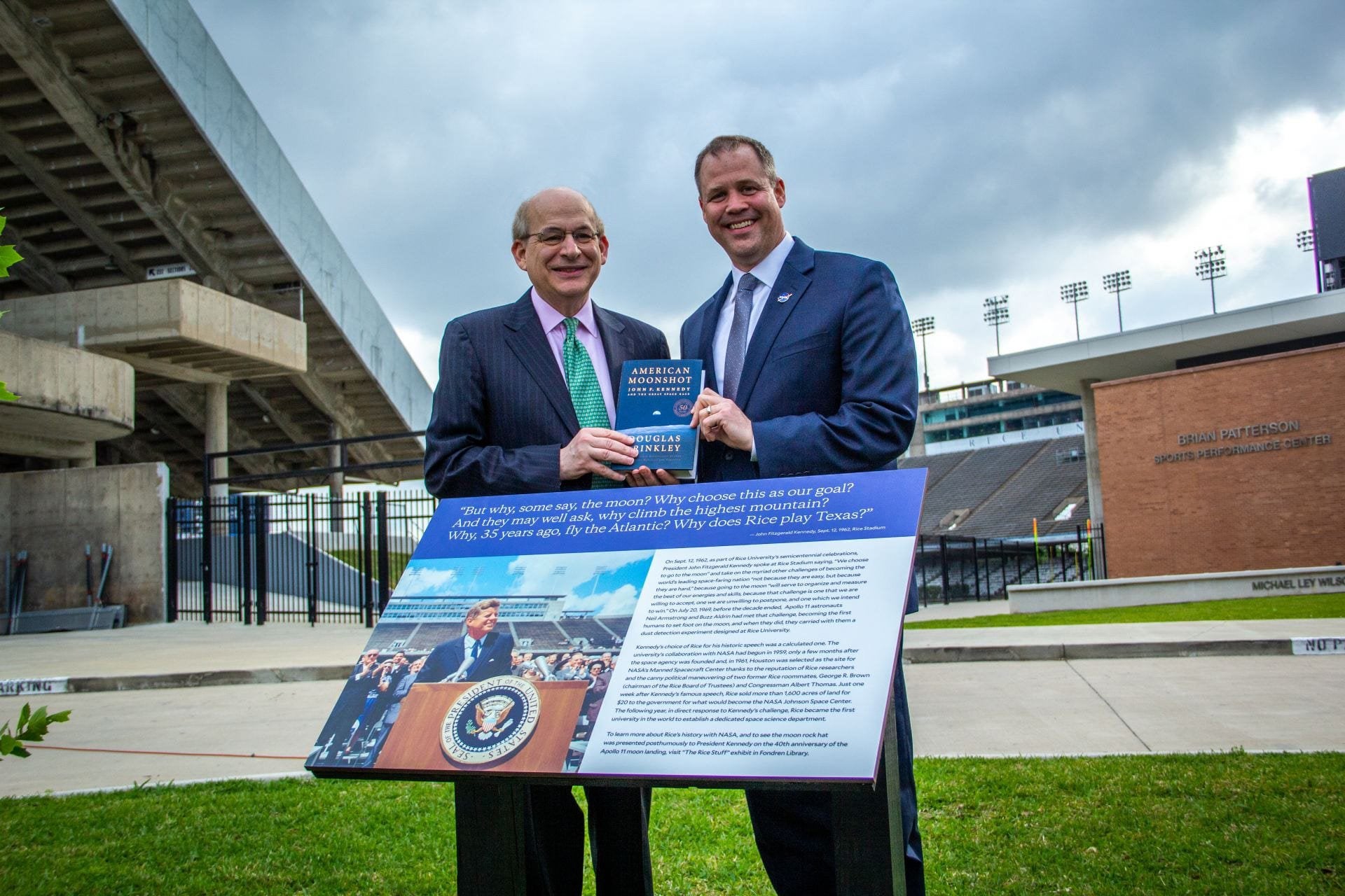 Bridenstine and Leebron holding book at plaque dedication